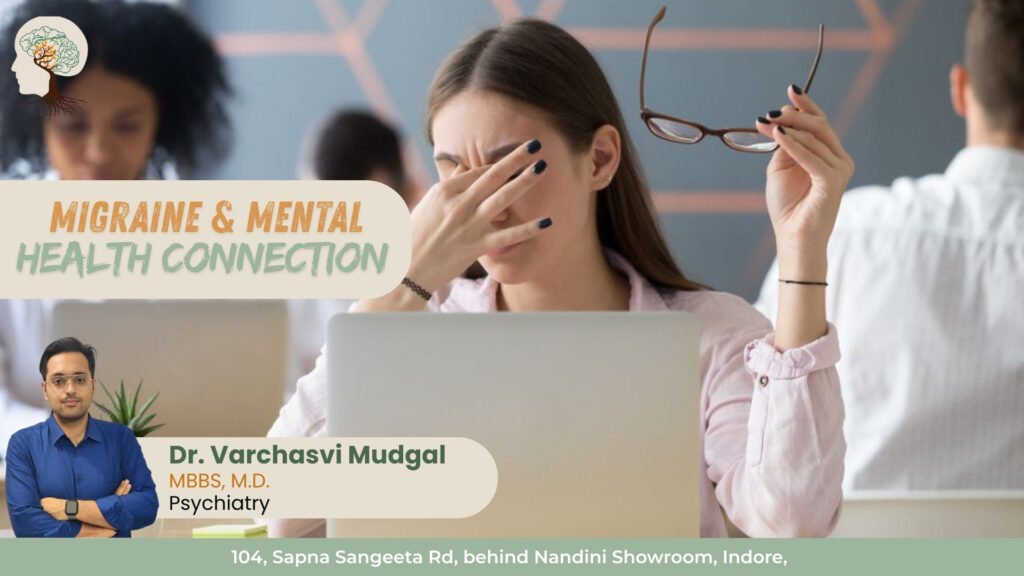 Woman experiencing migraine pain at work showing the connection between migraine and mental health treated by Dr. Varchasvi Mudgal, Best Psychiatrist in Indore